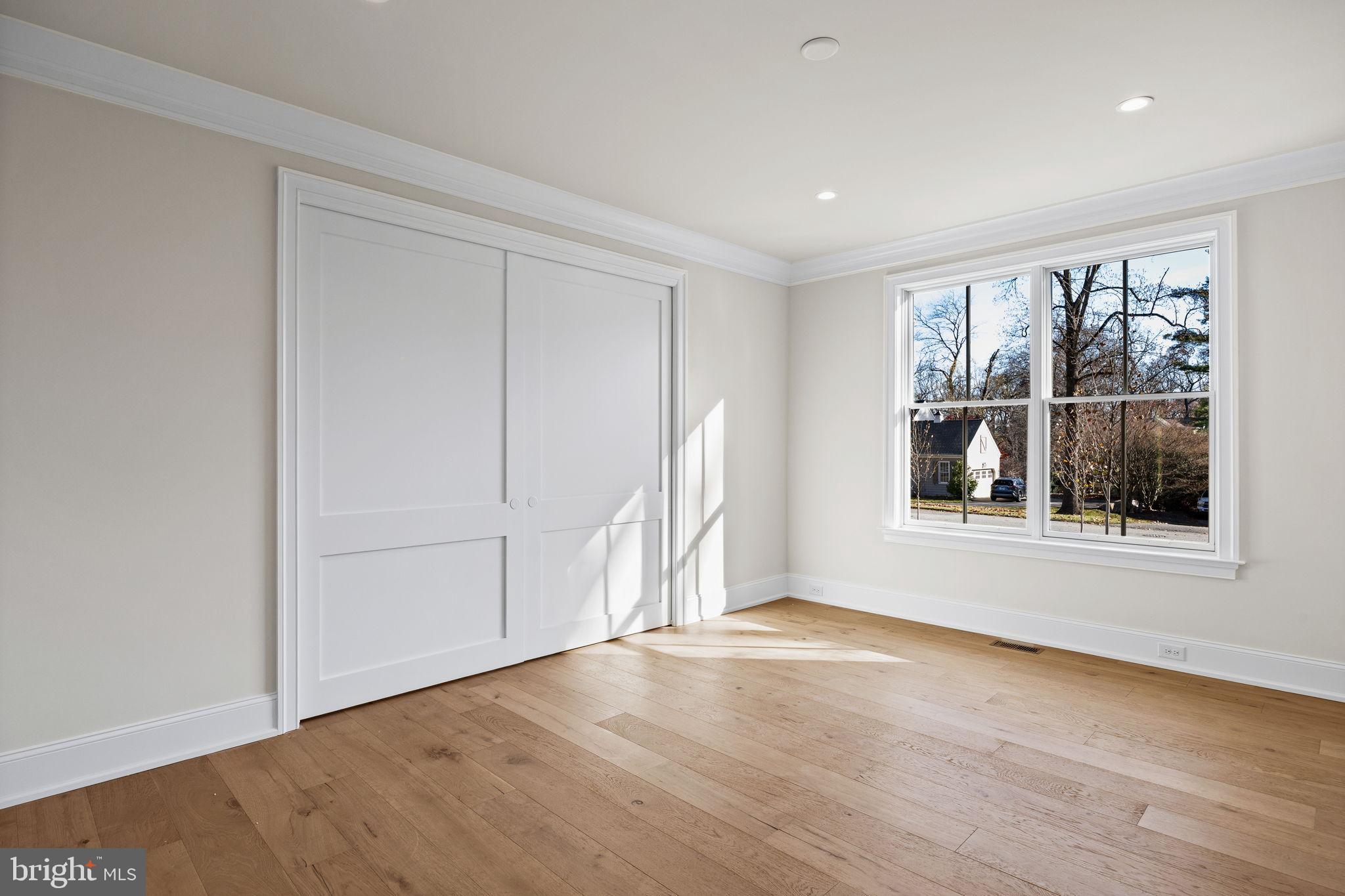 16 Fariston Road Wayne, PA 19087 - Photo 14 of 106 a view of an empty room with a window and wooden floor