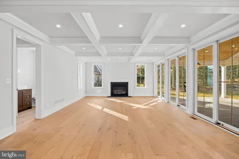 a kitchen with granite countertop a sink stove and cabinets