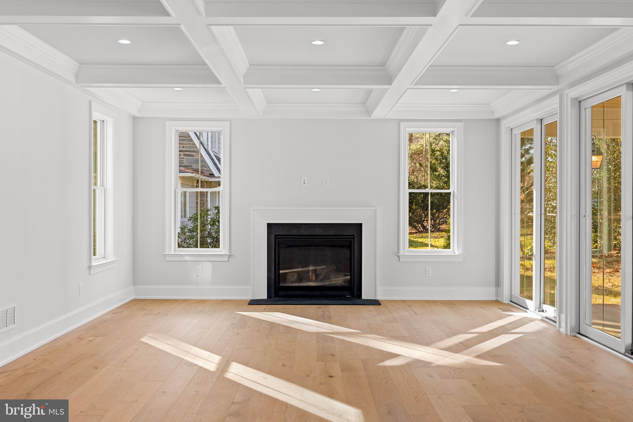 16 Fariston Road Wayne, PA 19087 - Photo 18 of 106 a living room with a fireplace and a window
