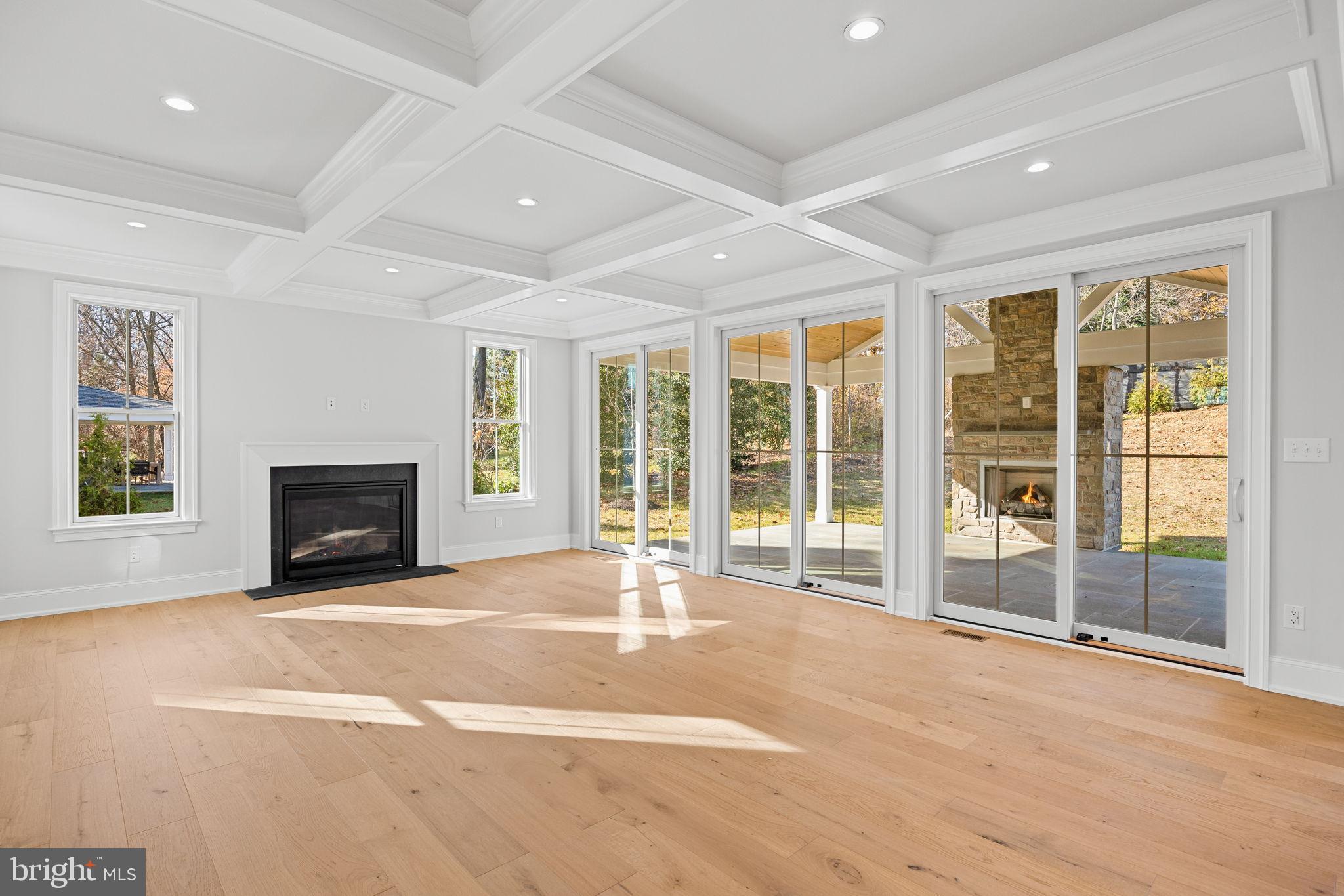 16 Fariston Road Wayne, PA 19087 - Photo 20 of 106 a view of an empty room with a fireplace and a large window