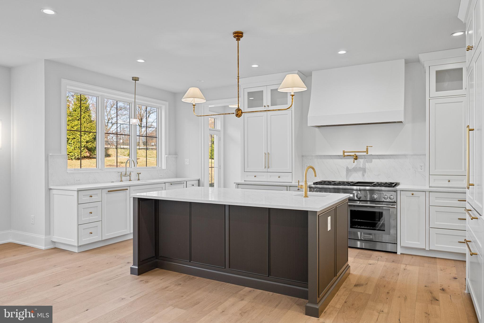 16 Fariston Road Wayne, PA 19087 - Photo 27 of 106 a kitchen with stainless steel appliances granite countertop a sink stove and refrigerator