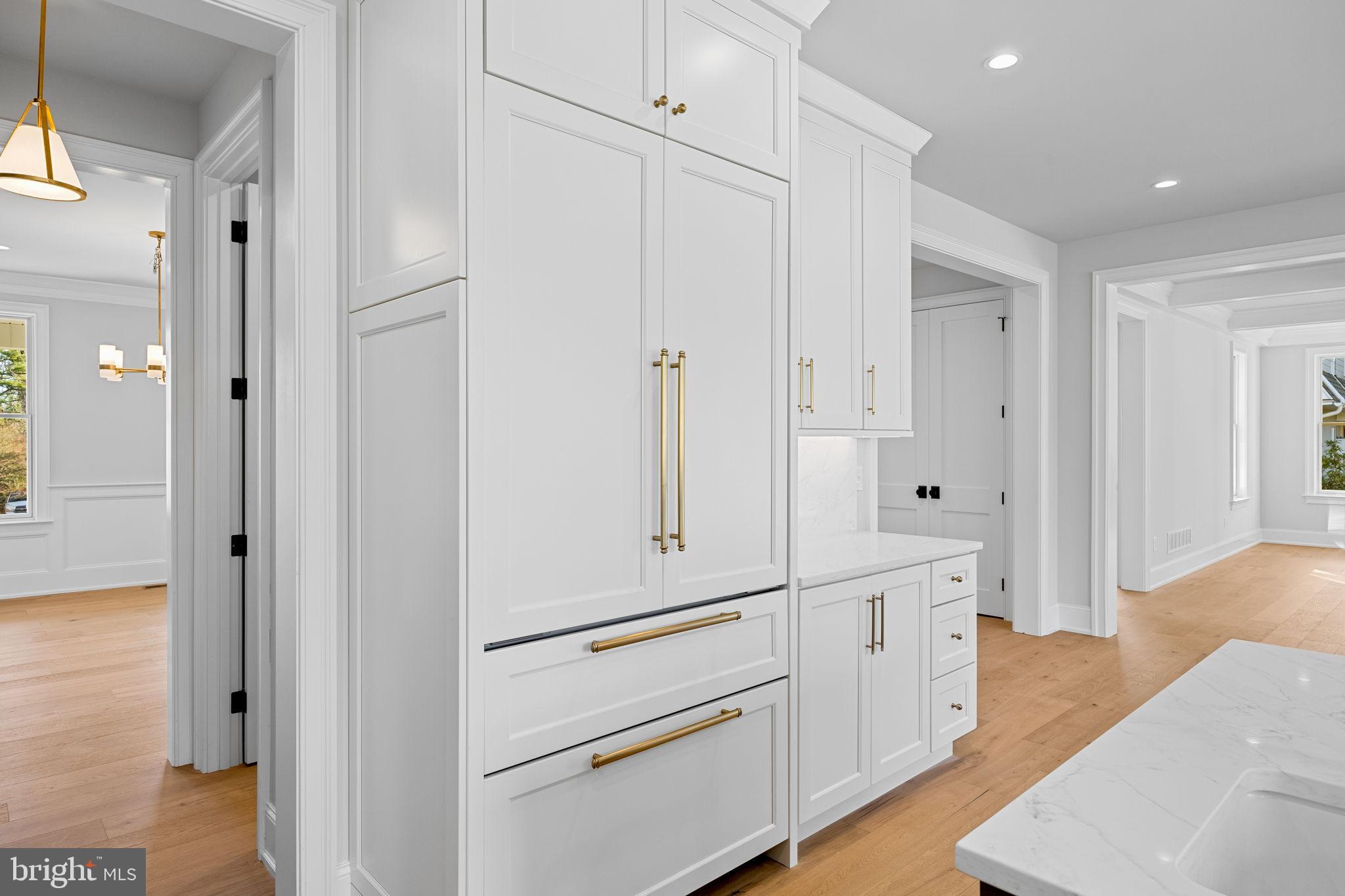 16 Fariston Road Wayne, PA 19087 - Photo 31 of 106 a hallway with white cabinets and wooden floors