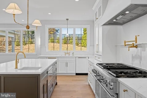 a view of hallway with wooden floor