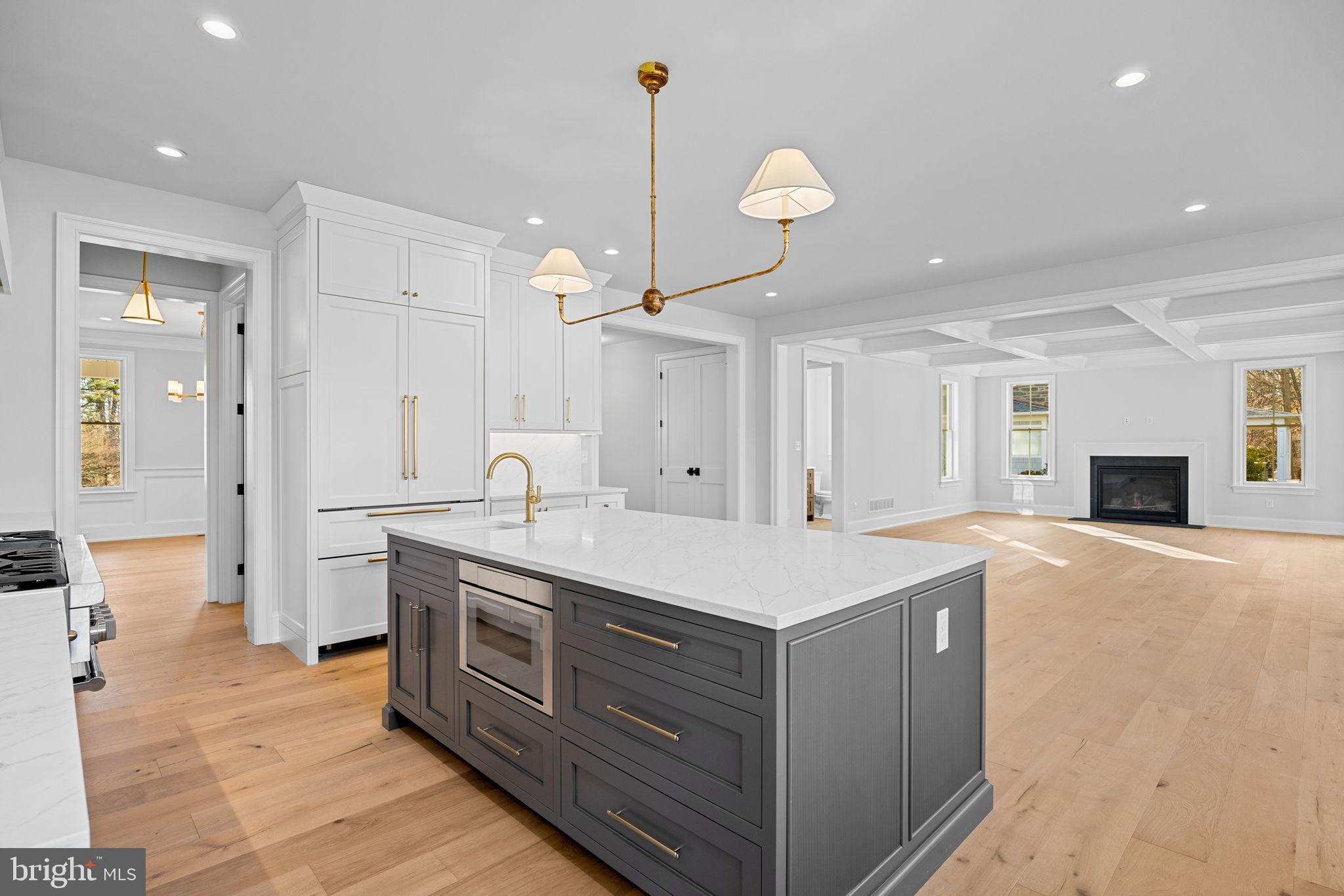 16 Fariston Road Wayne, PA 19087 - Photo 35 of 106 a large kitchen with stainless steel appliances a large counter top a refrigerator a sink and a wooden floors