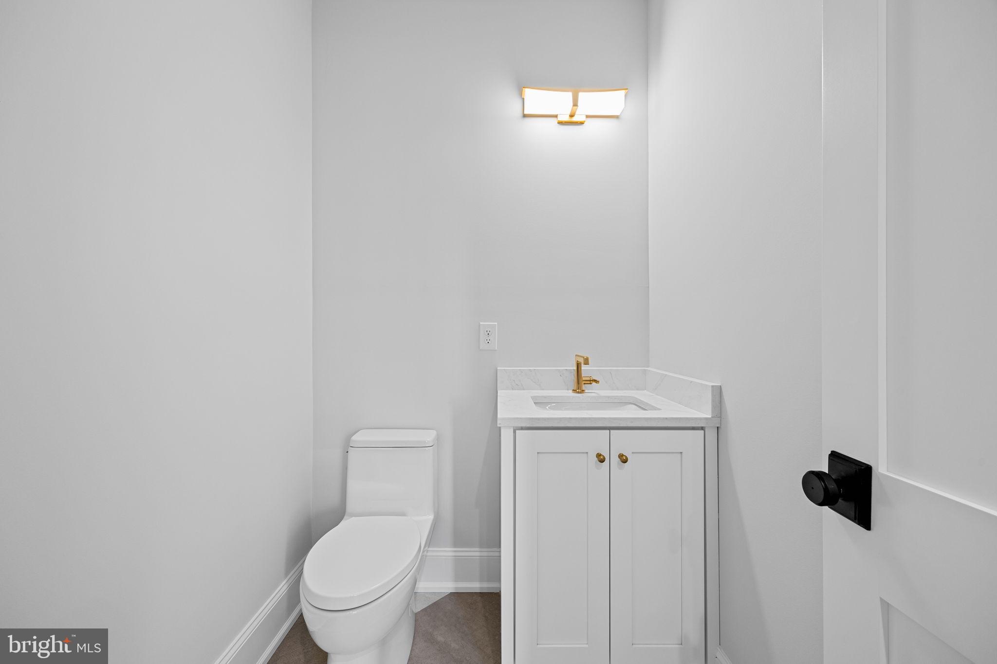 16 Fariston Road Wayne, PA 19087 - Photo 44 of 106 a bathroom with a toilet a sink and mirror