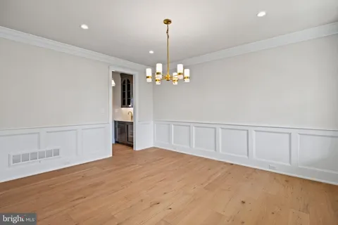 a view of a pathway both side of the house