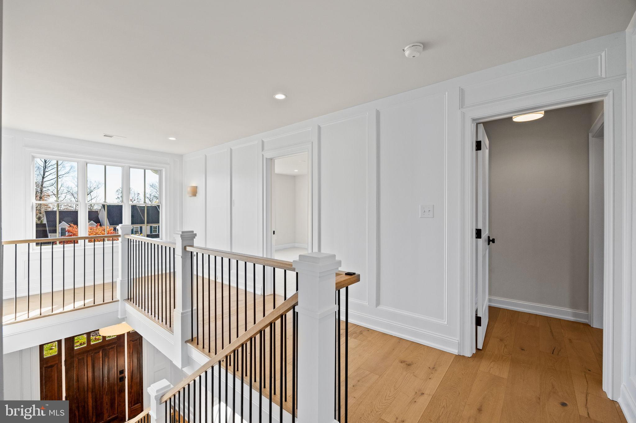 16 Fariston Road Wayne, PA 19087 - Photo 51 of 106 a view of a hallway with wooden floor and windows