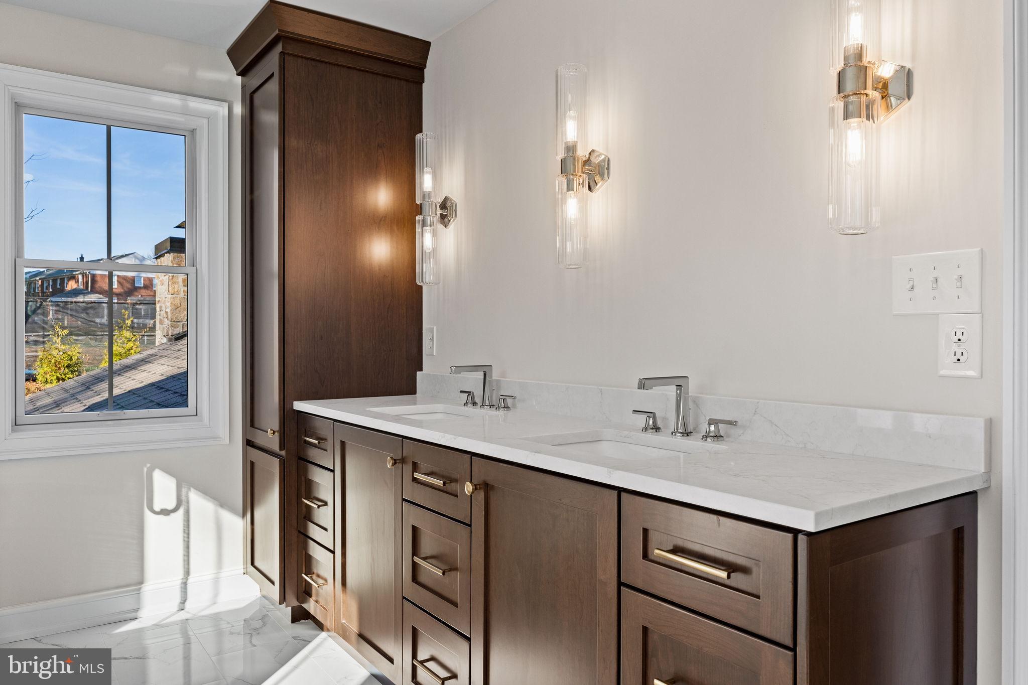 16 Fariston Road Wayne, PA 19087 - Photo 62 of 106 a bathroom with a sink and a mirror
