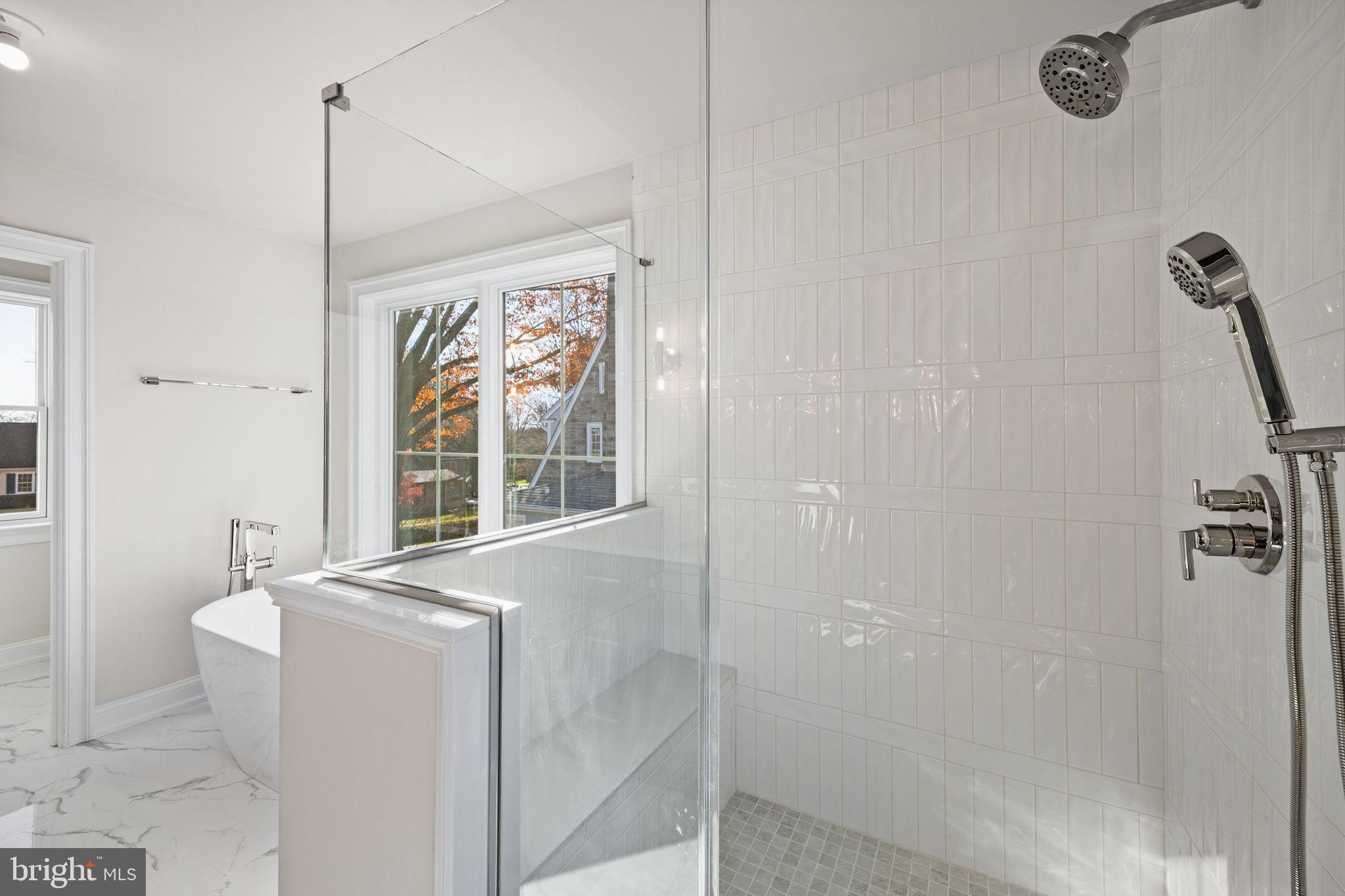 16 Fariston Road Wayne, PA 19087 - Photo 64 of 106 a bathroom with a granite countertop sink a mirror and a shower