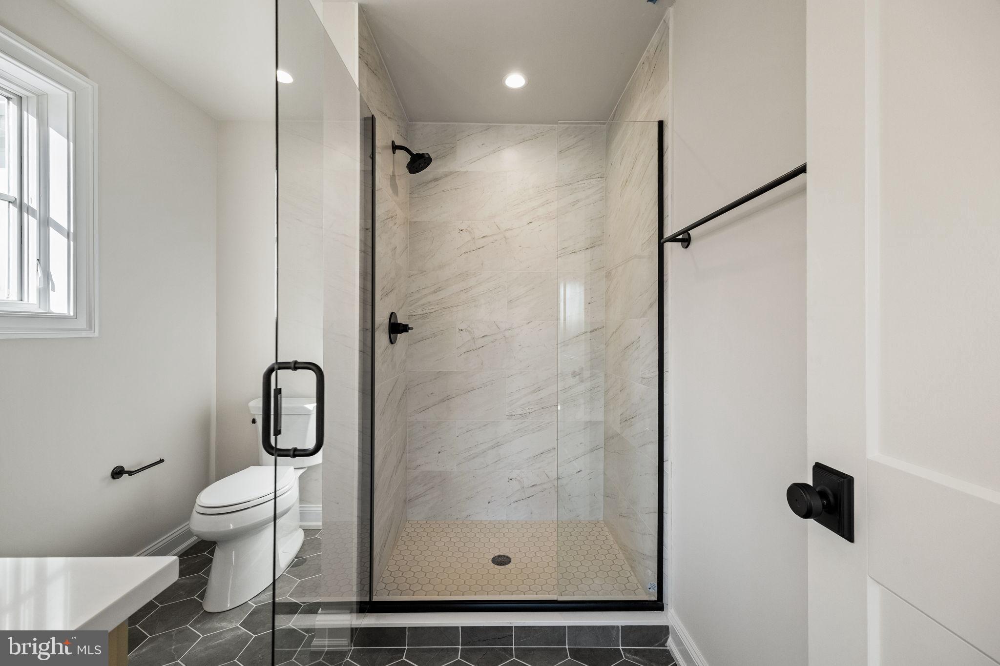 16 Fariston Road Wayne, PA 19087 - Photo 69 of 106 a bathroom with a shower a toilet and a sink