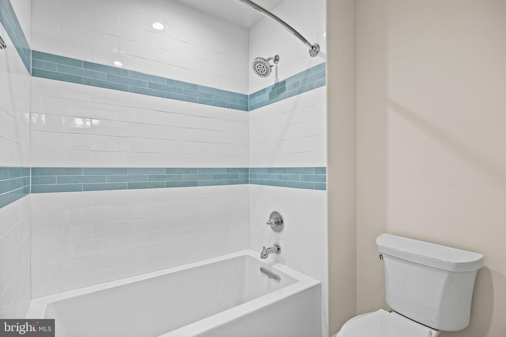 16 Fariston Road Wayne, PA 19087 - Photo 76 of 106 a bathroom with a bathtub and a toilet