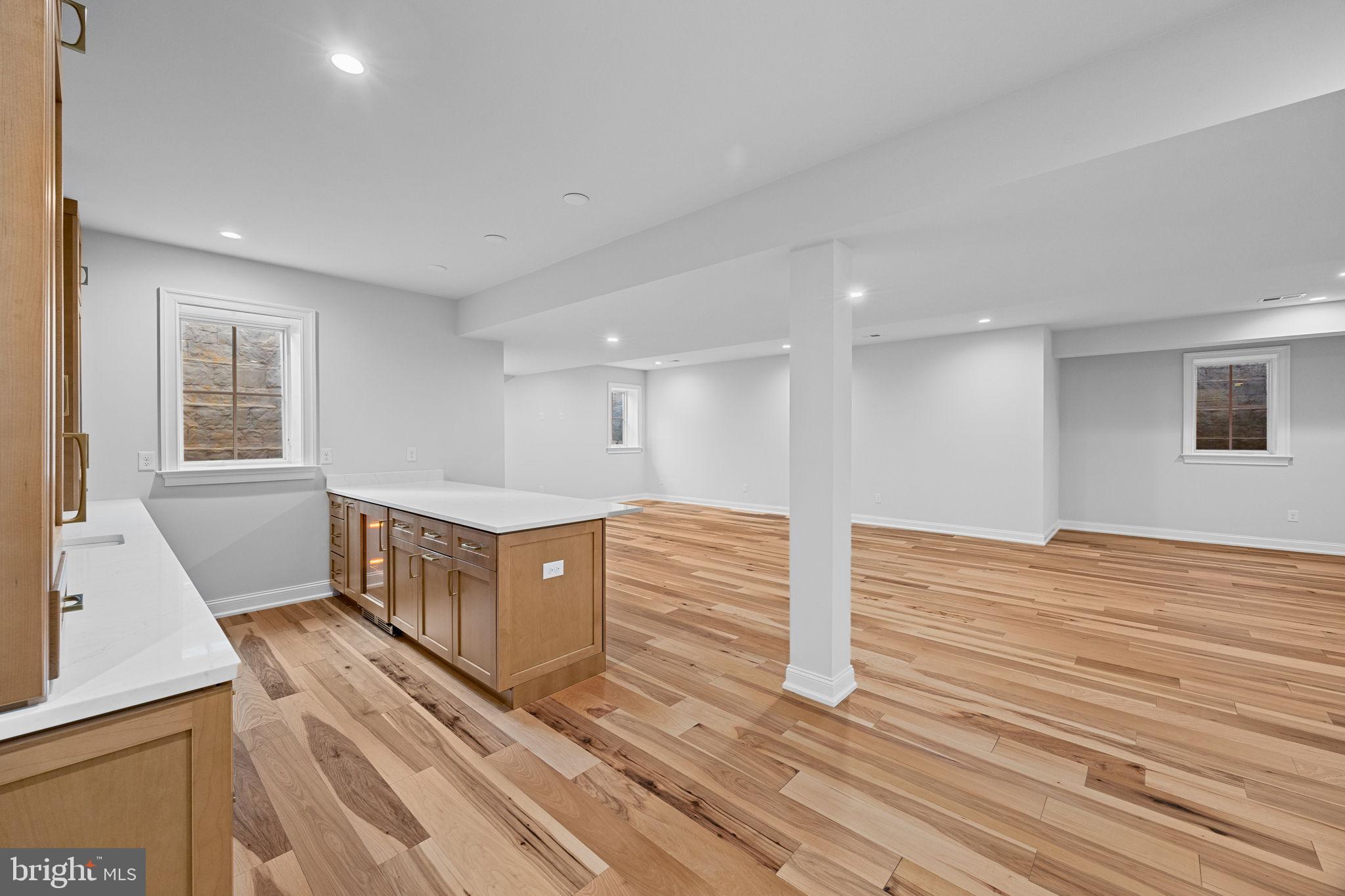 16 Fariston Road Wayne, PA 19087 - Photo 87 of 106 a view of an empty room with wooden floor and a window