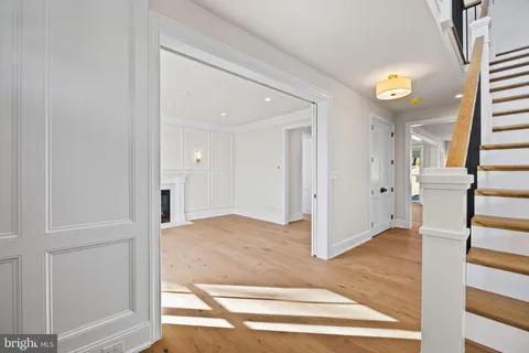 a view of an empty room with a fireplace and a large window