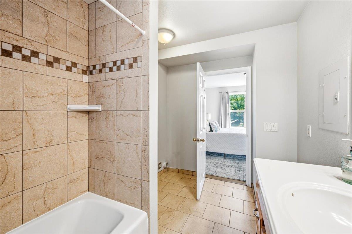 232 Upper Slate Creek Road Grass Valley, CA 95945 - Photo 22 of 48 a bathroom with a bathtub and shower