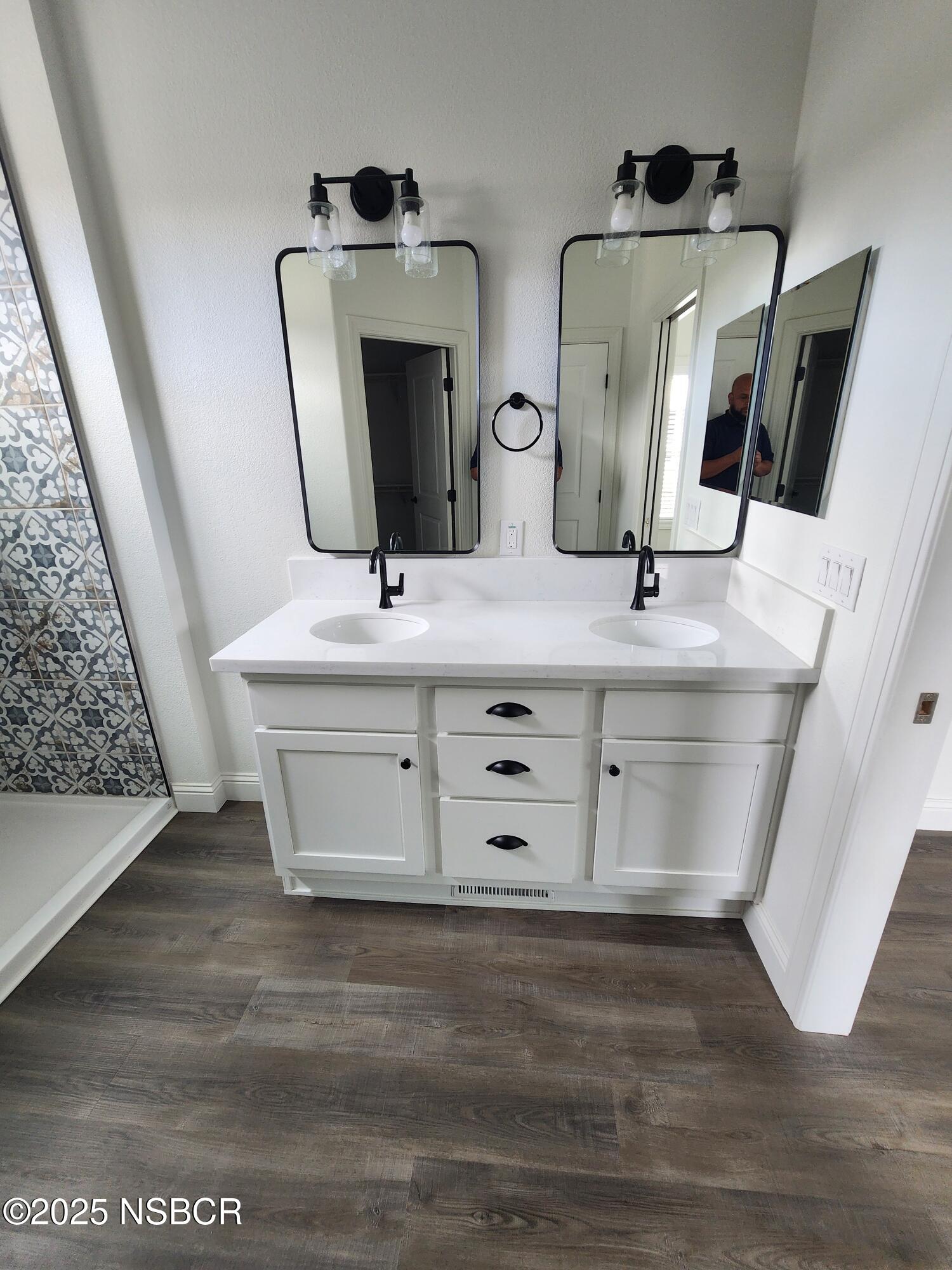 87 Rio Vista Solvang, CA 93463 - Photo 15 of 18 a bathroom with double vanity and a mirror