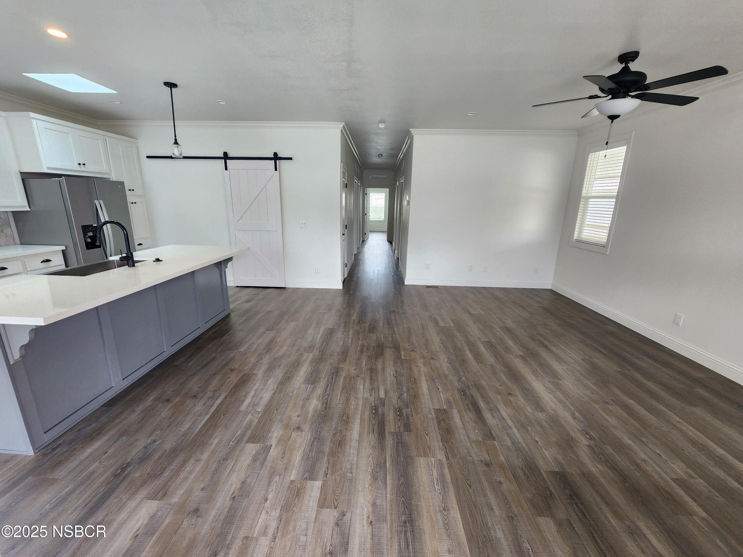 87 Rio Vista Solvang, CA 93463 - Photo 2 of 18 a view of a kitchen with a sink and wooden floor
