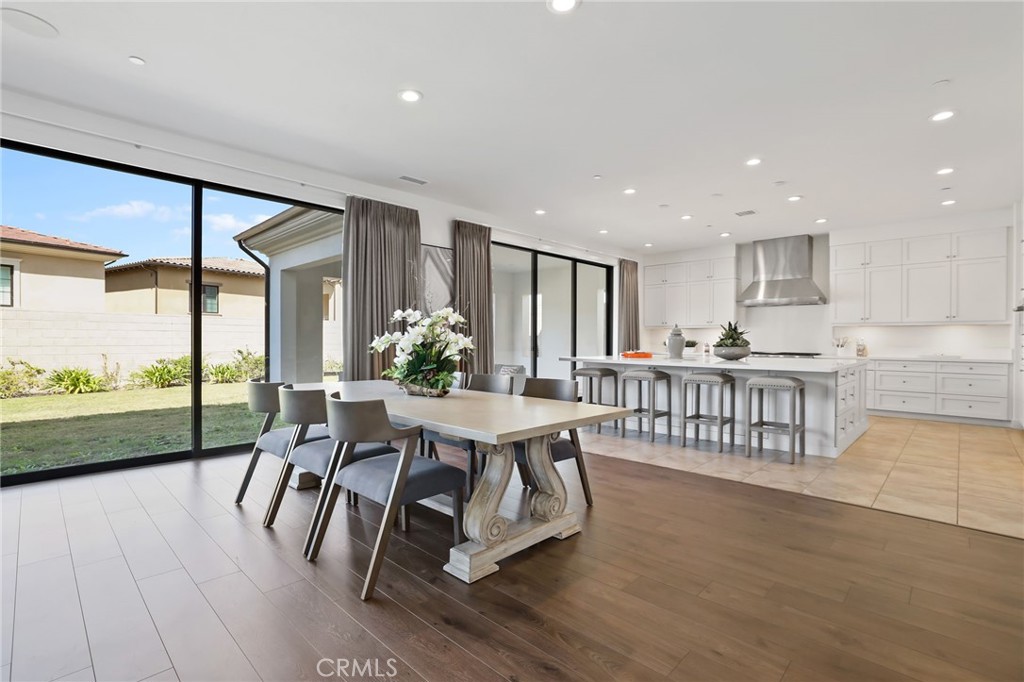 74 Egret Irvine, CA 92618 - Photo 14 of 74 a view of a dining room with furniture window and wooden floor