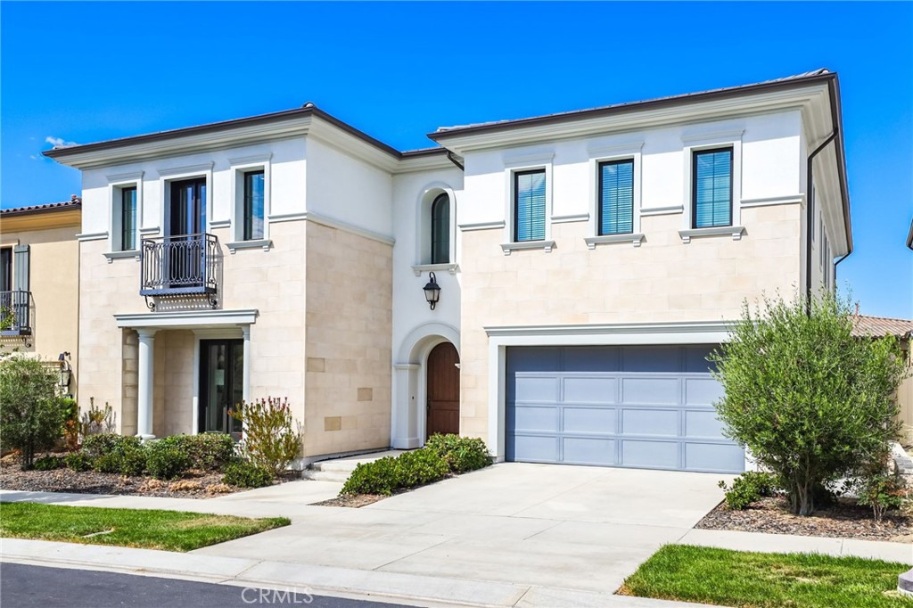 74 Egret Irvine, CA 92618 - Photo 2 of 74 a front view of a house with a yard and garage