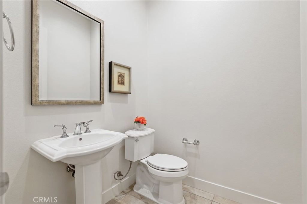 74 Egret Irvine, CA 92618 - Photo 24 of 74 a white toilet sitting next to a bathroom sink