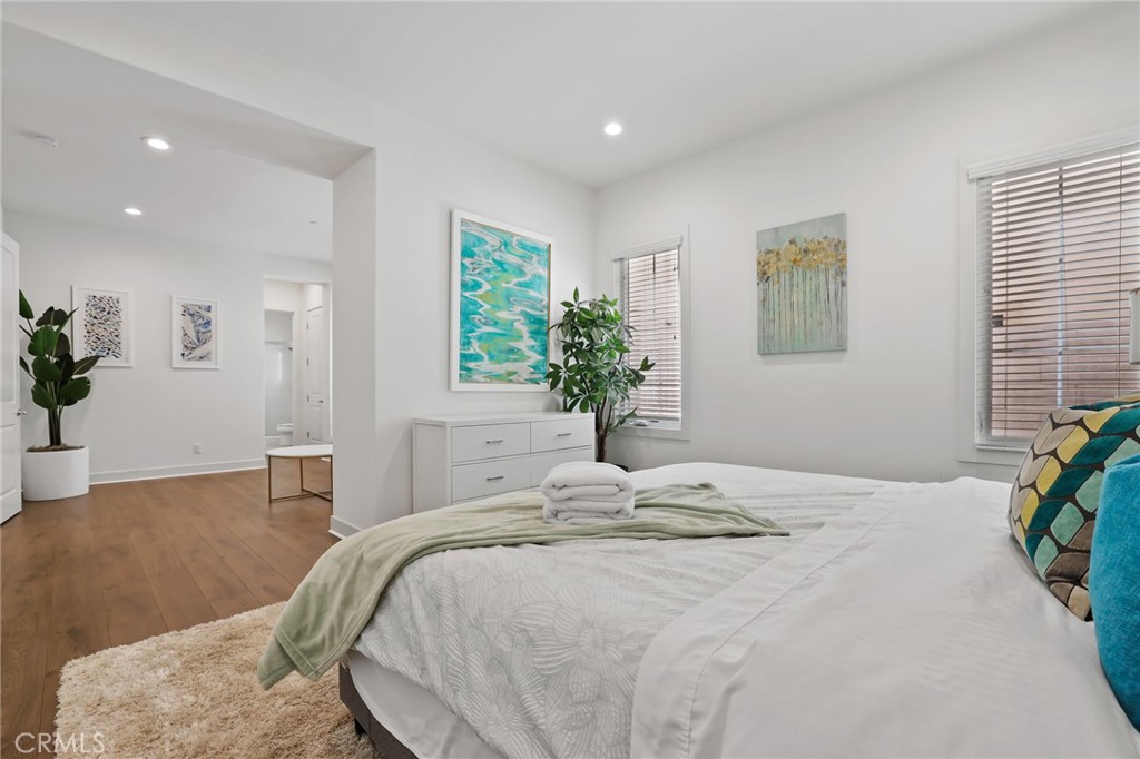 74 Egret Irvine, CA 92618 - Photo 30 of 74 a bedroom with a bed and a potted plant