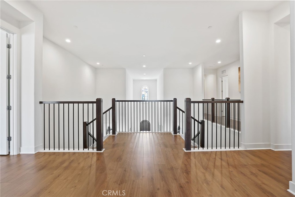 74 Egret Irvine, CA 92618 - Photo 32 of 74 a view of a hallway with wooden floor