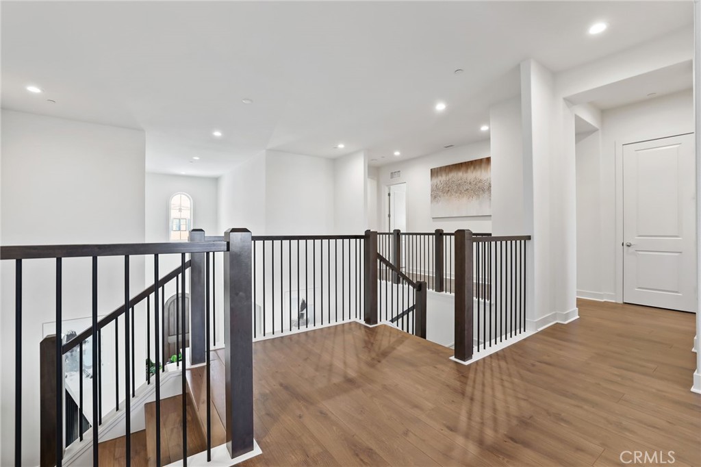 74 Egret Irvine, CA 92618 - Photo 33 of 74 a view of a hallway with wooden floor