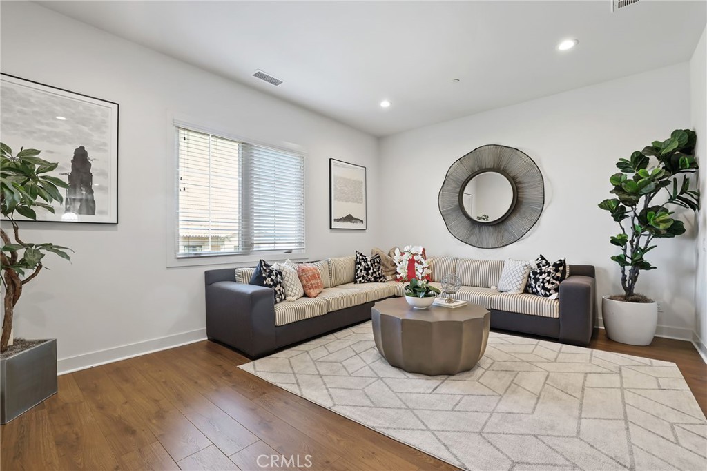 74 Egret Irvine, CA 92618 - Photo 36 of 74 a living room with furniture a window and a potted plant