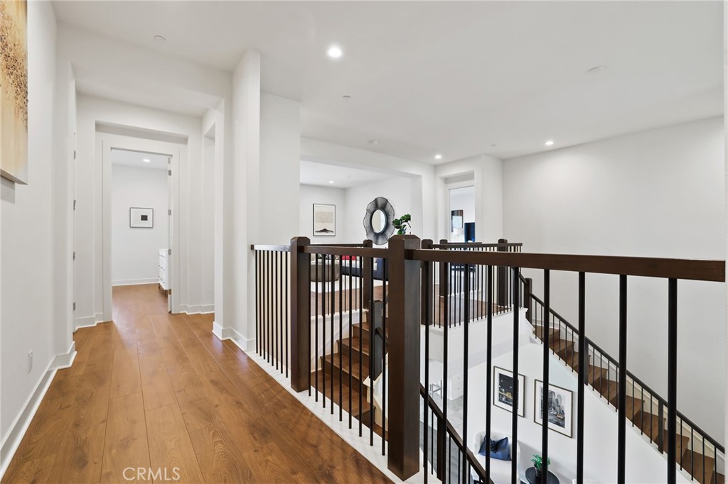 74 Egret Irvine, CA 92618 - Photo 39 of 74 a view of a hallway with wooden floor and stairs