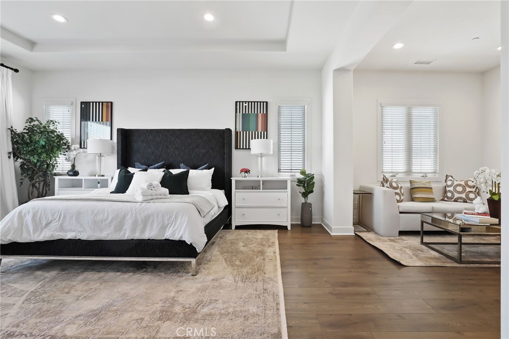 74 Egret Irvine, CA 92618 - Photo 46 of 74 a spacious bedroom with a bed and a large window