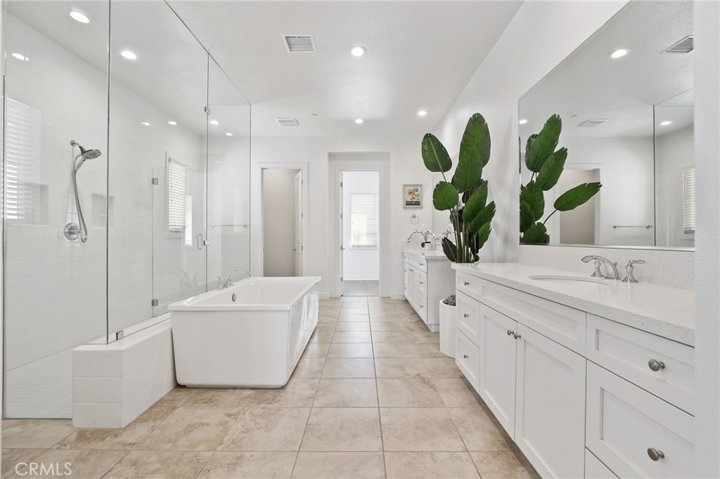 74 Egret Irvine, CA 92618 - Photo 53 of 74 a bathroom with a double vanity sink mirror and bathtub