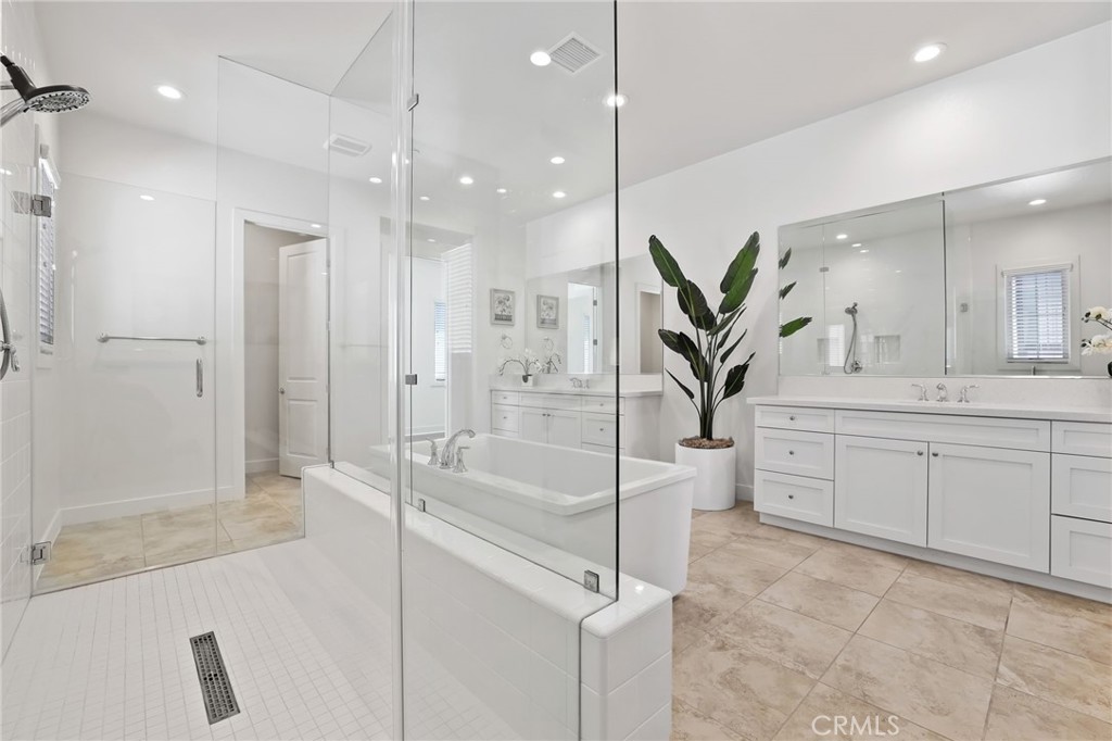 74 Egret Irvine, CA 92618 - Photo 58 of 74 a spacious bathroom with a shower sink and mirror