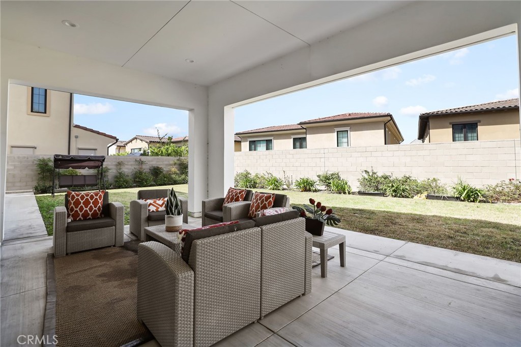 74 Egret Irvine, CA 92618 - Photo 67 of 74 a living room with furniture and a floor to ceiling window