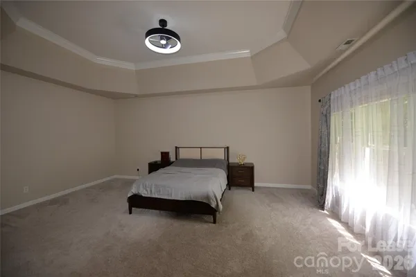 a spacious bathroom with a tub sink and mirror