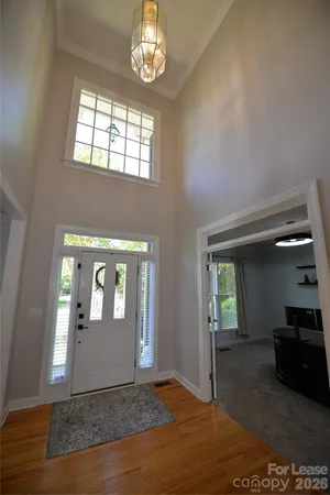 a bedroom with a bed and a mirror