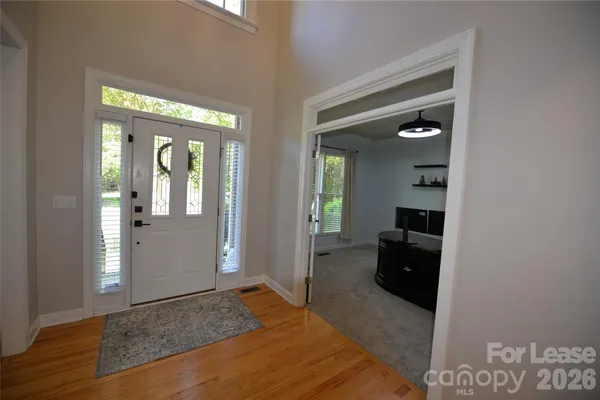a view of a dining room with furniture and window