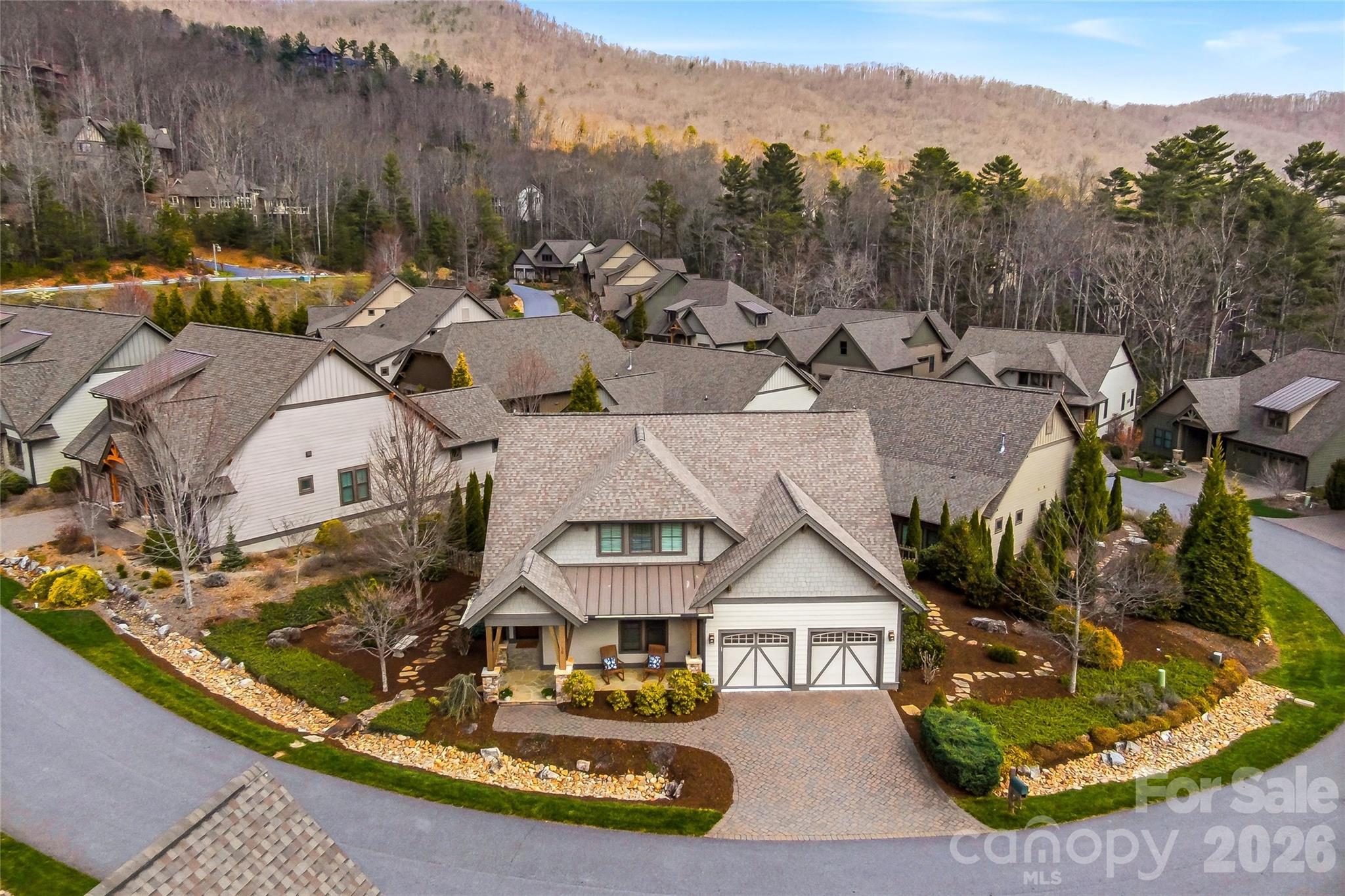 a view of a house with a yard and sitting area