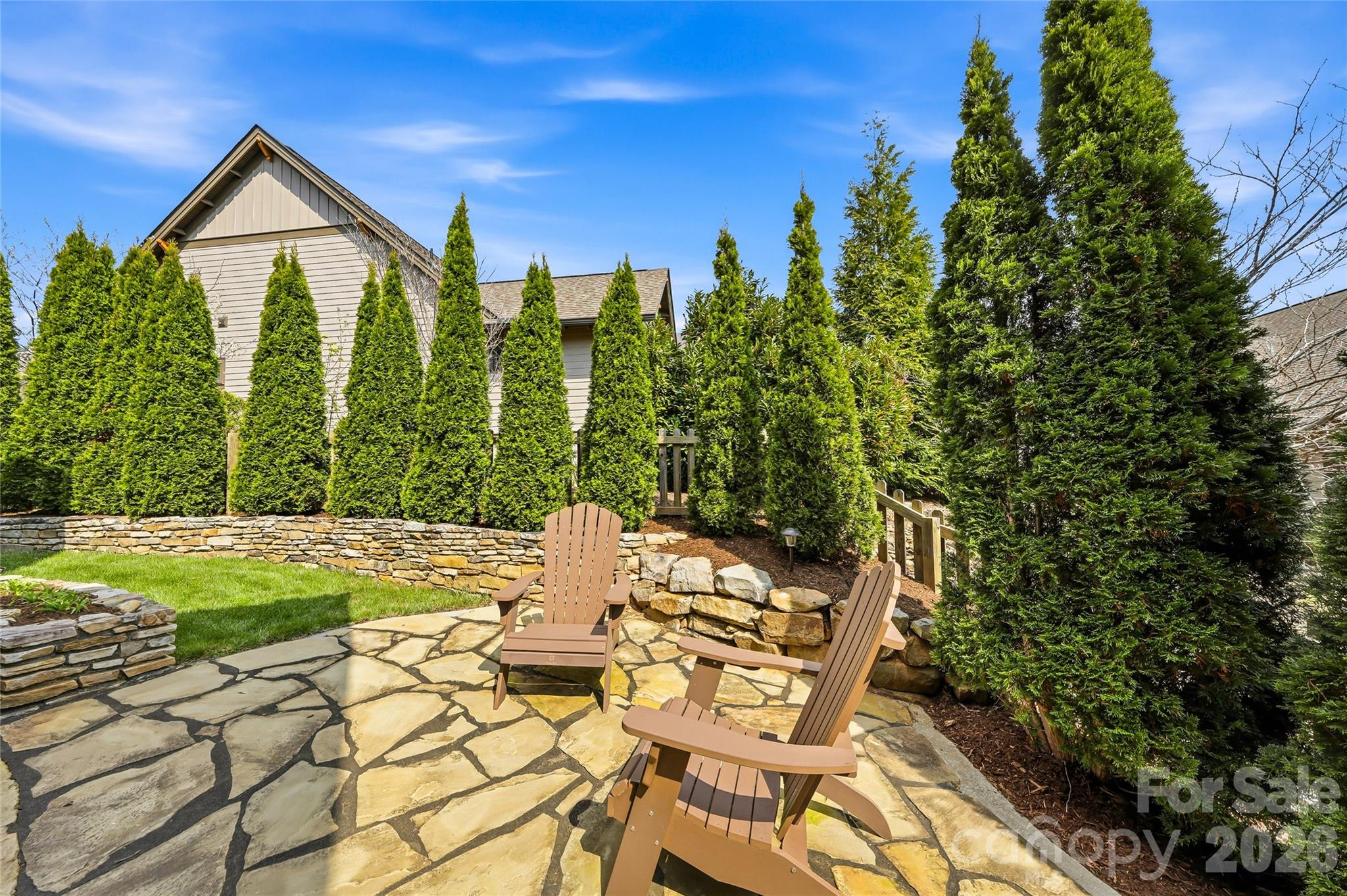 30 Still Creek Loop Fairview, NC 28730 - Photo 14 of 45 a view of a patio with table and chairs and potted plants