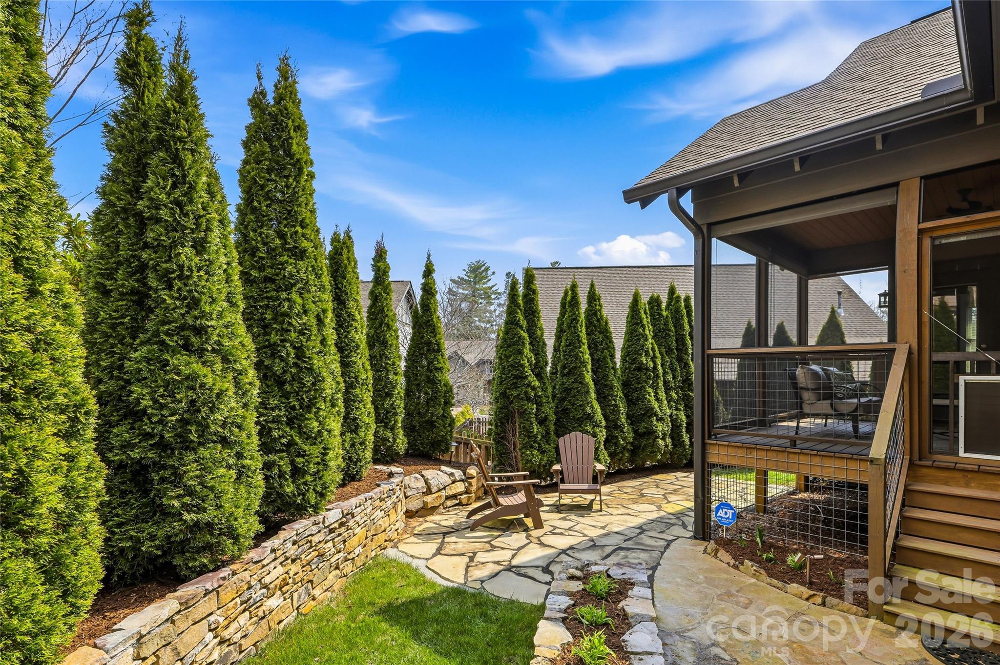 30 Still Creek Loop Fairview, NC 28730 - Photo 15 of 45 a view of a patio with table and chairs with wooden floor and fence
