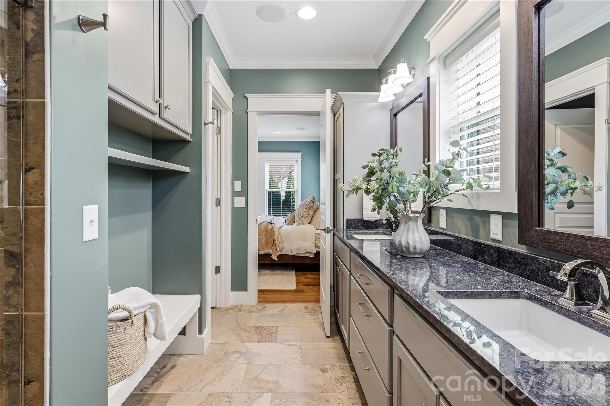 30 Still Creek Loop Fairview, NC 28730 - Photo 18 of 45 a spacious en suite bathroom with a granite countertop sink and mirror