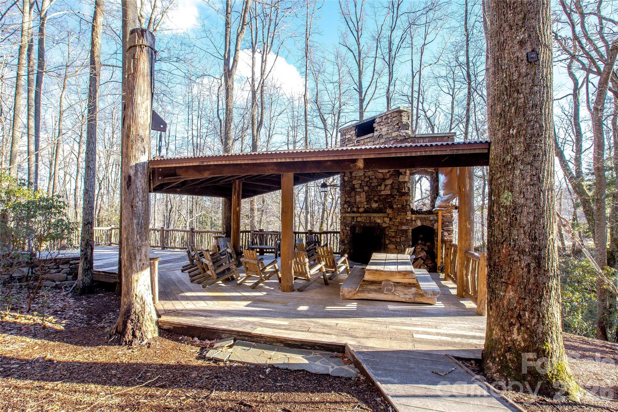 30 Still Creek Loop Fairview, NC 28730 - Photo 41 of 45 a view of a patio with table and chairs and floor to ceiling window