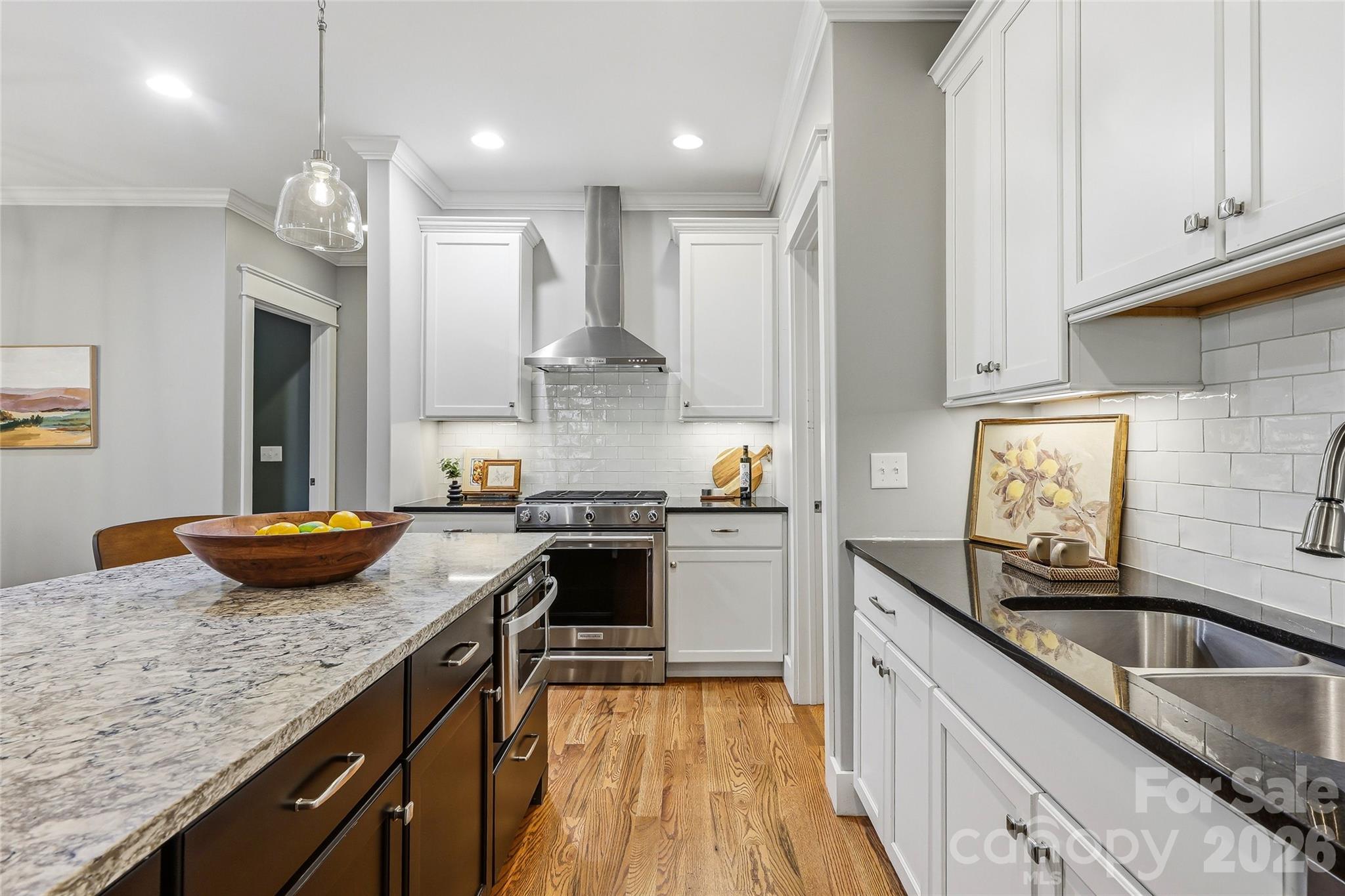 30 Still Creek Loop Fairview, NC 28730 - Photo 9 of 45 a kitchen with granite countertop kitchen island stainless steel appliances a sink stove top oven and cabinets
