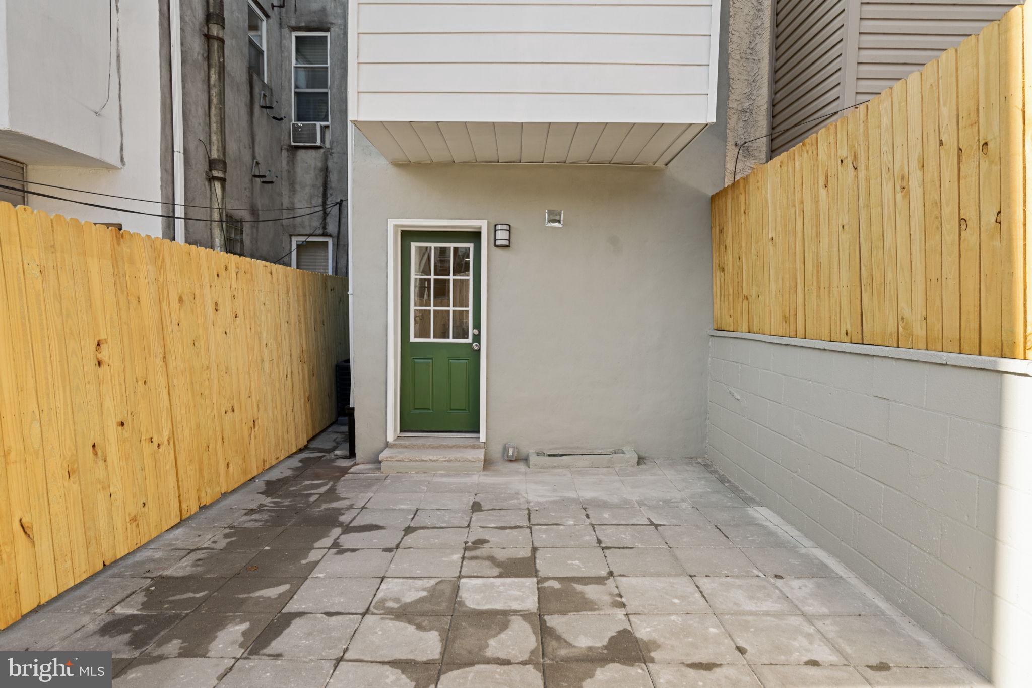1937 South Lambert Street Philadelphia, PA 19145 - Photo 25 of 34 Charming entryway with vibrant green door.