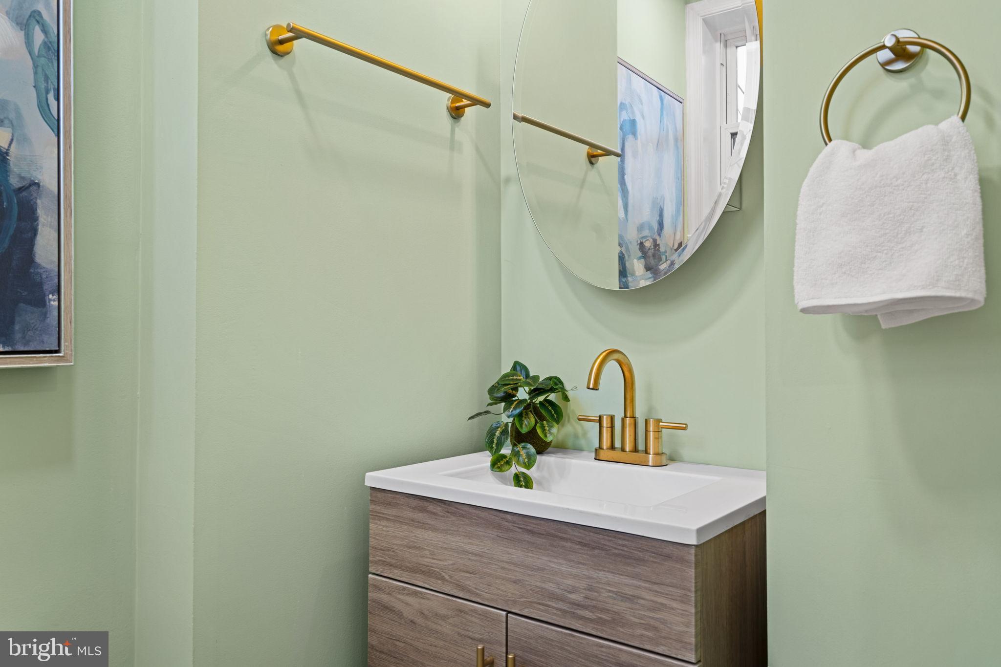 1937 South Lambert Street Philadelphia, PA 19145 - Photo 9 of 34 Chic bathroom with gold accents and greenery.