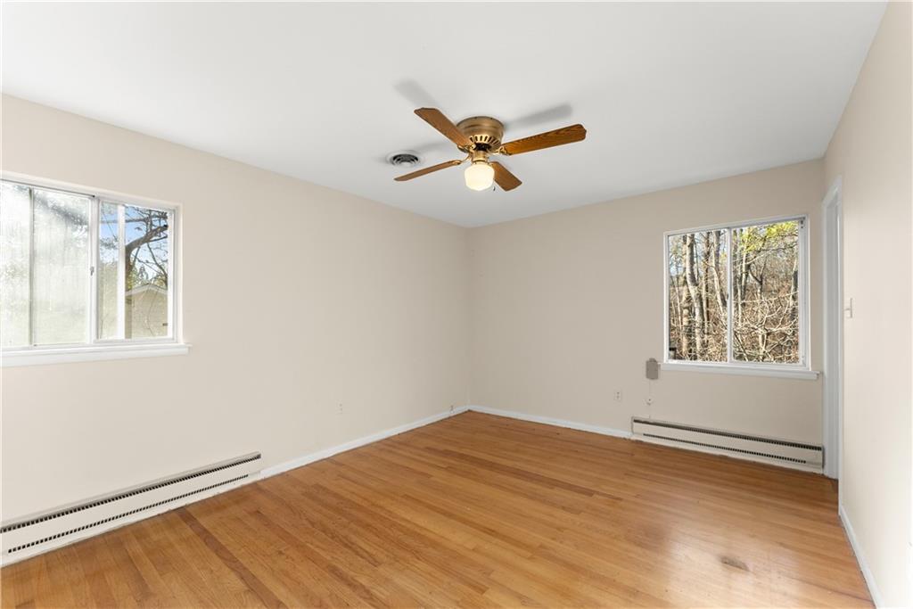 660 Honeysuckle Road Gainesville, GA 30501 - Photo 12 of 43 a view of a big room with windows and chandelier fan