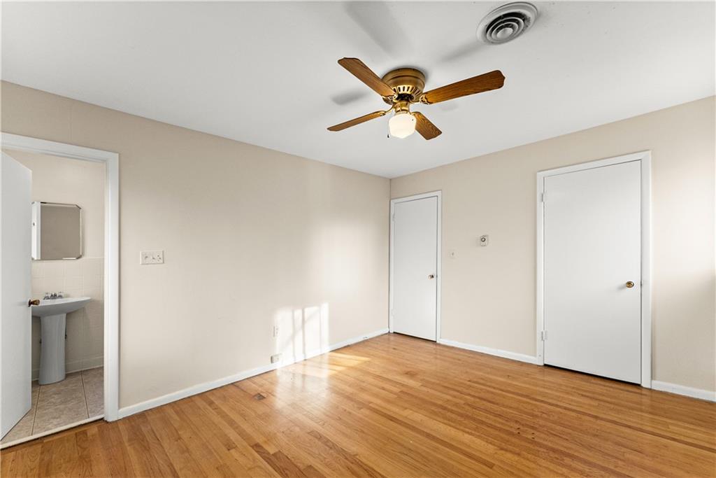 660 Honeysuckle Road Gainesville, GA 30501 - Photo 13 of 43 a view of a room with wooden floor and white walls