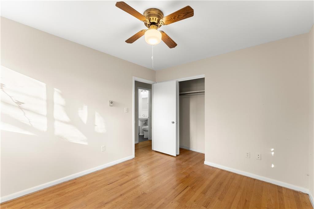 660 Honeysuckle Road Gainesville, GA 30501 - Photo 18 of 43 a view of an empty room with window and wooden floor