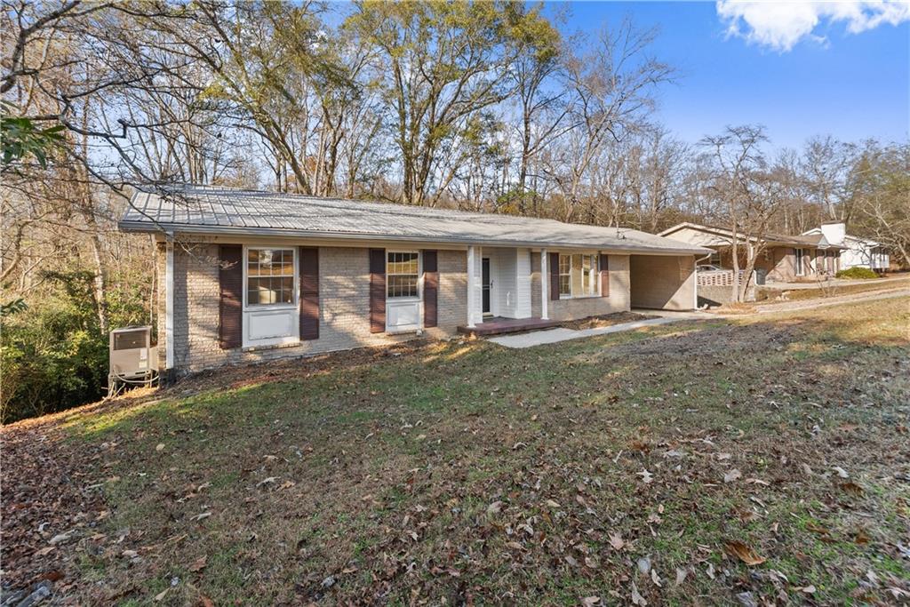 660 Honeysuckle Road Gainesville, GA 30501 - Photo 2 of 43 a front view of a house with a yard