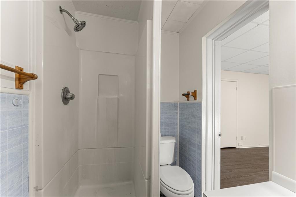 660 Honeysuckle Road Gainesville, GA 30501 - Photo 25 of 43 a bathroom with a toilet and a shower