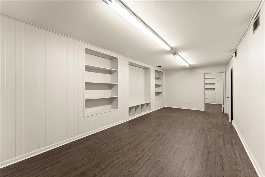 660 Honeysuckle Road Gainesville, GA 30501 - Photo 30 of 43 wooden floor in an empty room with a window