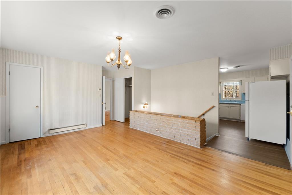660 Honeysuckle Road Gainesville, GA 30501 - Photo 6 of 43 a view of an empty room with wooden floor